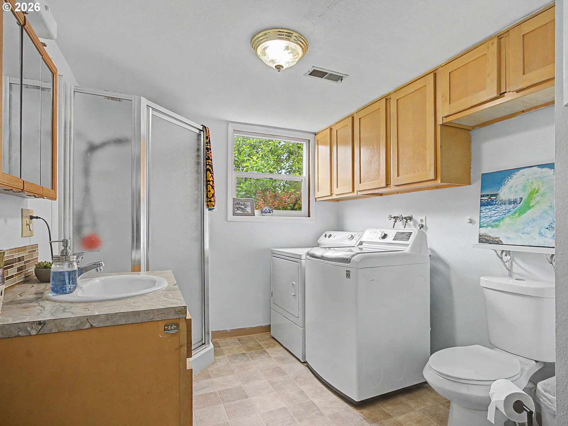 18015 Davis Street Sandy, OR 97055 - Photo 26 of 40 a view of bathroom with a sink toilet and a mirror