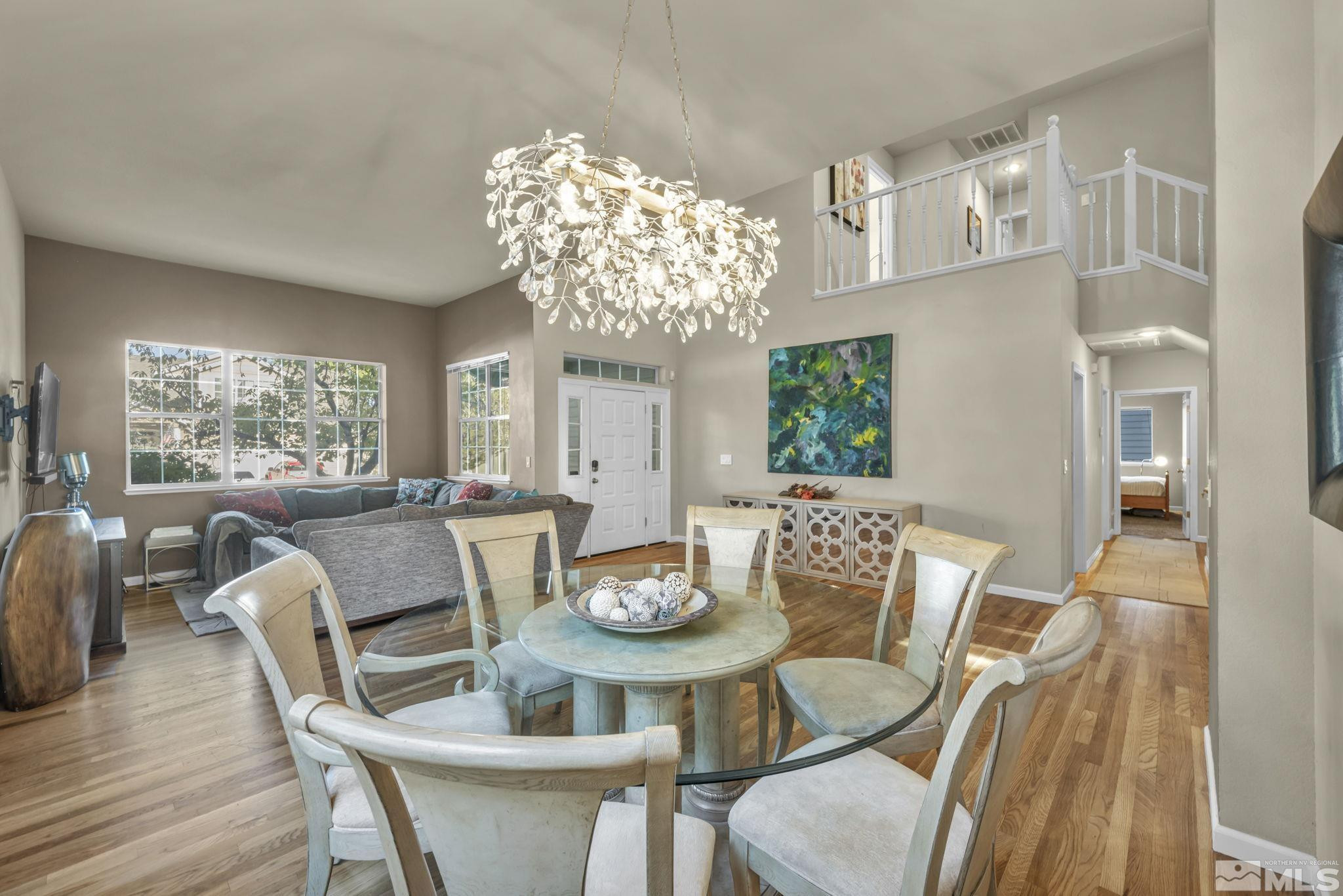4731 Ellicott Way Reno, NV 89519 - Photo 15 of 36 a view of a dining room with furniture window and wooden floor