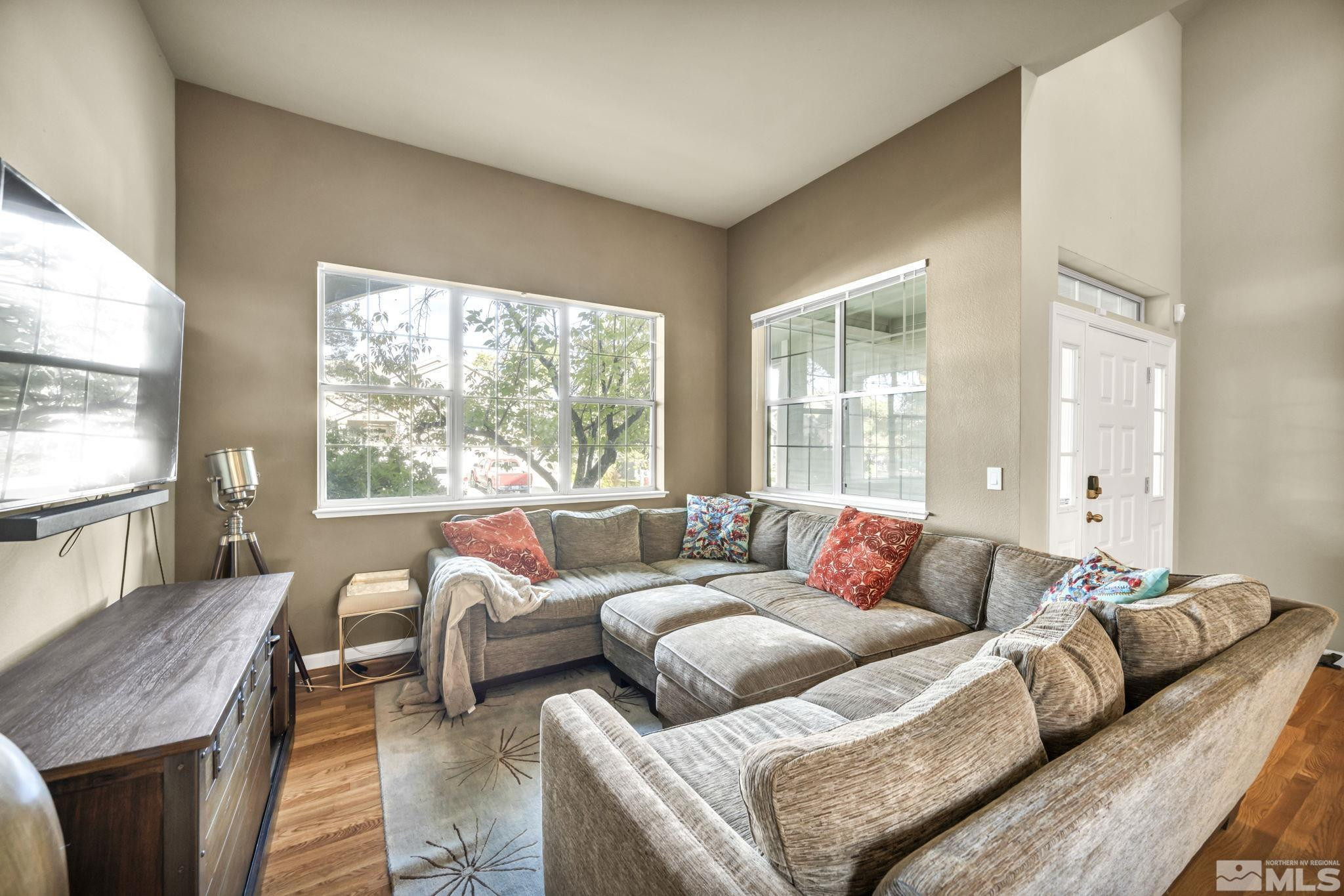 4731 Ellicott Way Reno, NV 89519 - Photo 16 of 36 a living room with furniture and a large window