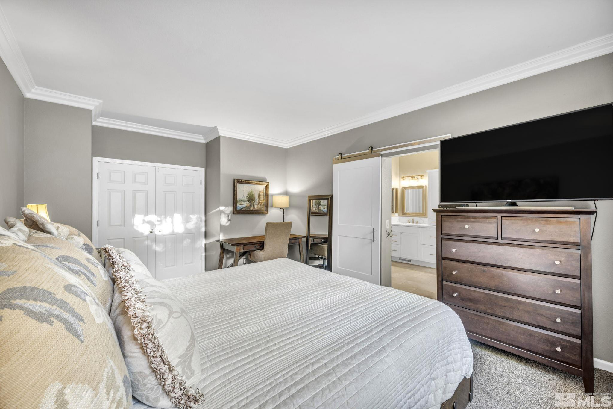 4731 Ellicott Way Reno, NV 89519 - Photo 20 of 36 a bedroom with a bed and a flat screen tv