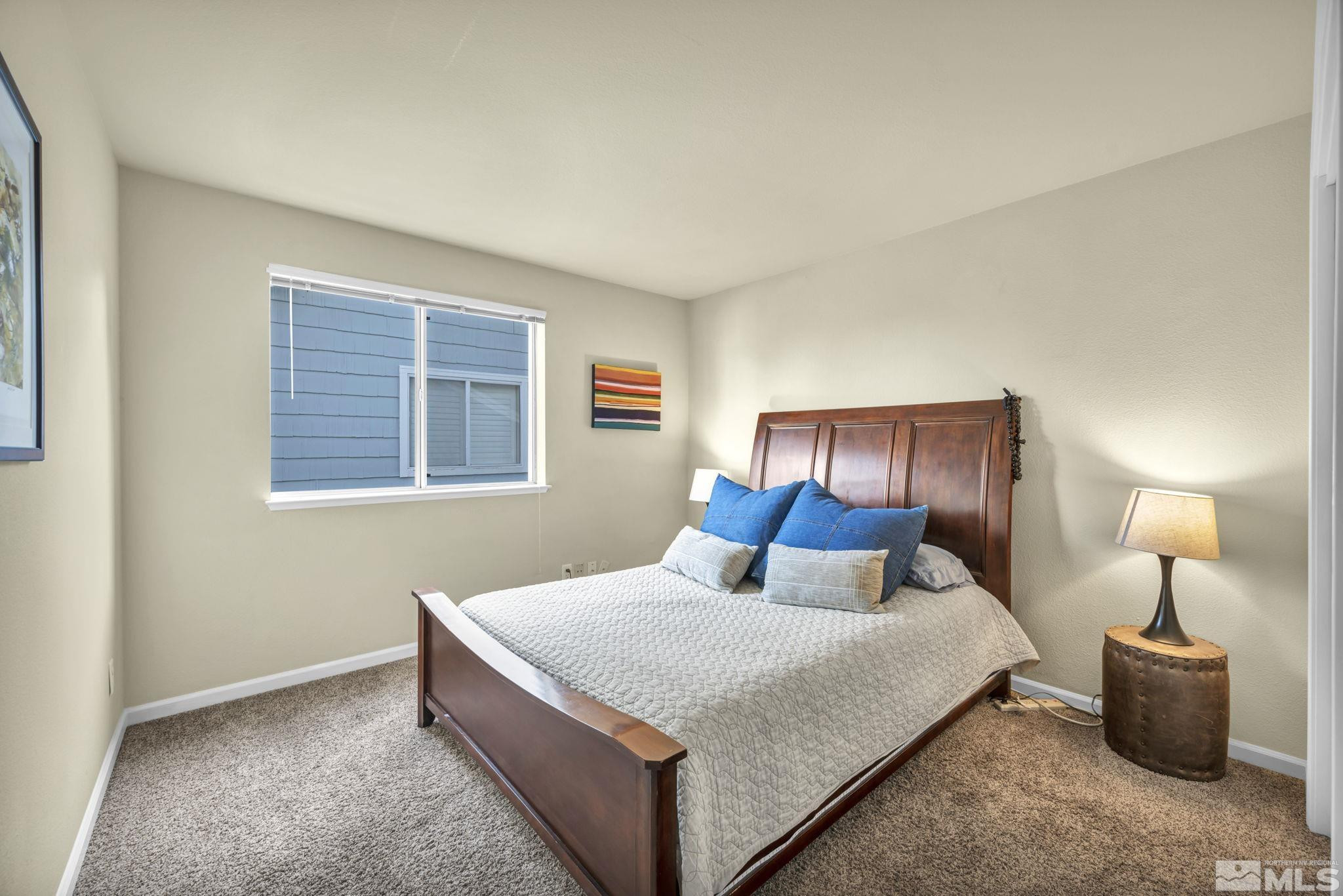 4731 Ellicott Way Reno, NV 89519 - Photo 28 of 36 a bedroom with a bed and window