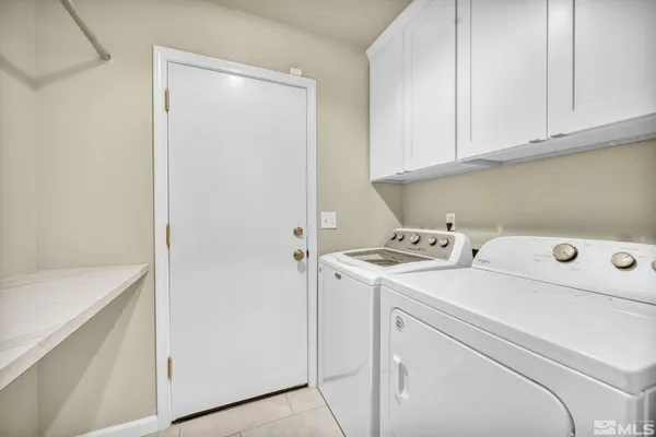 a view of storage and utility room with washer and dryer
