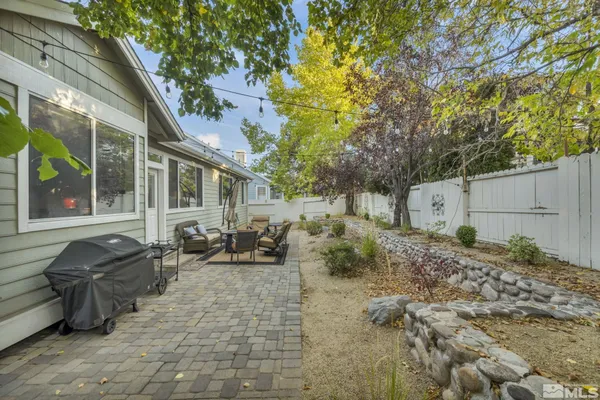 a backyard of a house with seating space