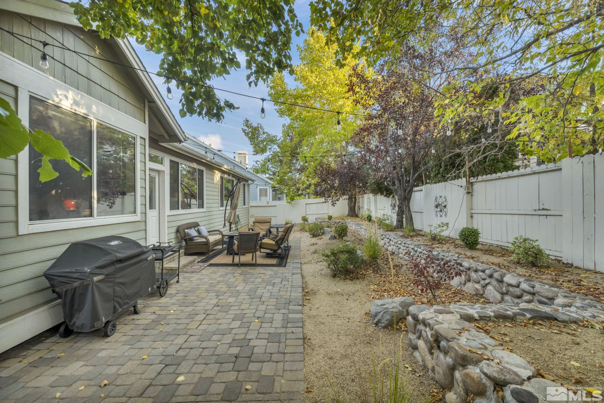 4731 Ellicott Way Reno, NV 89519 - Photo 35 of 36 a backyard of a house with seating space