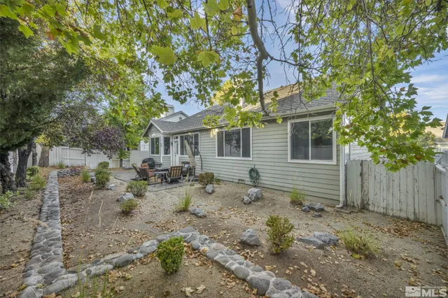 a backyard of a house with seating space