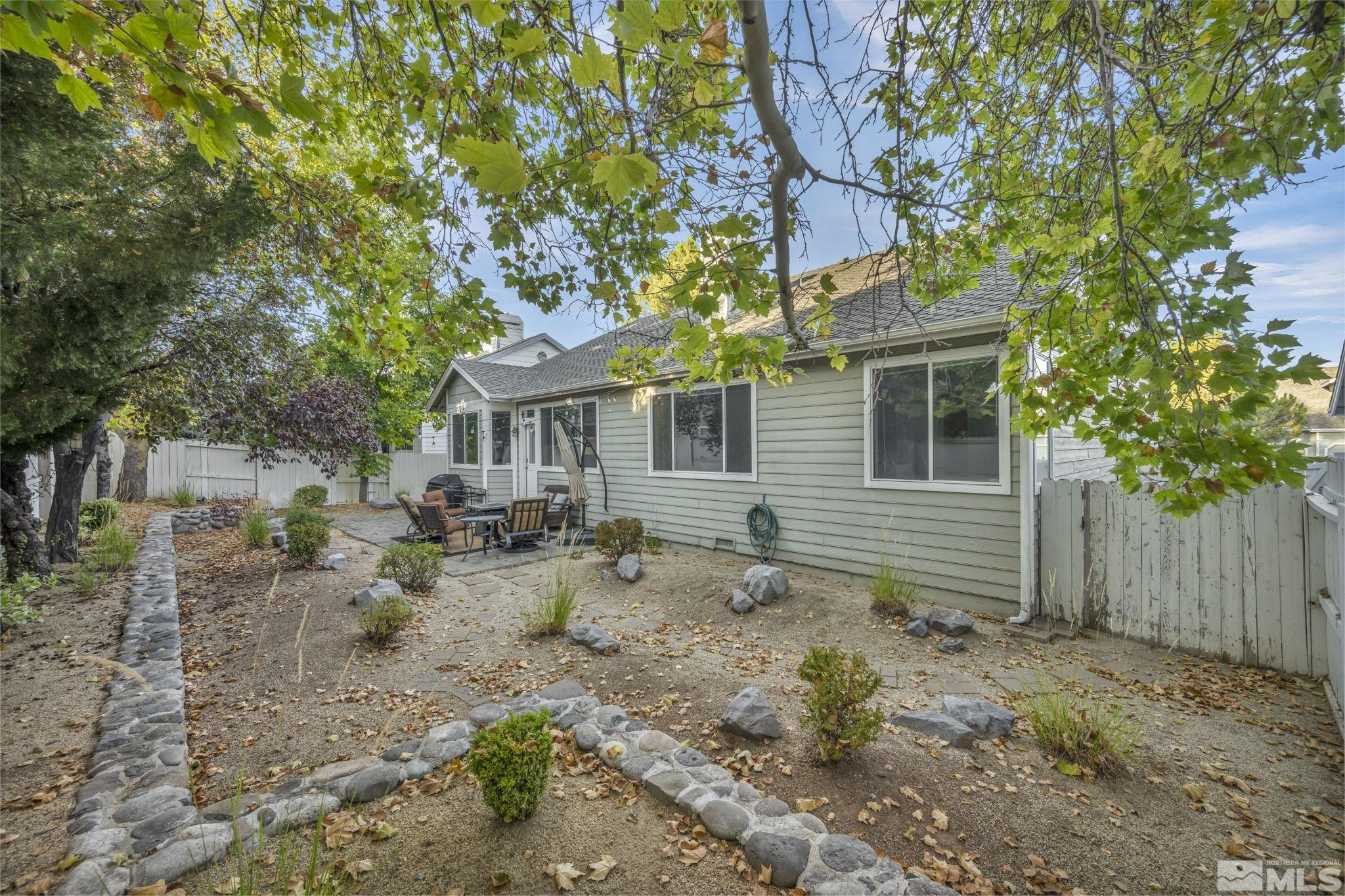 4731 Ellicott Way Reno, NV 89519 - Photo 36 of 36 a backyard of a house with seating space