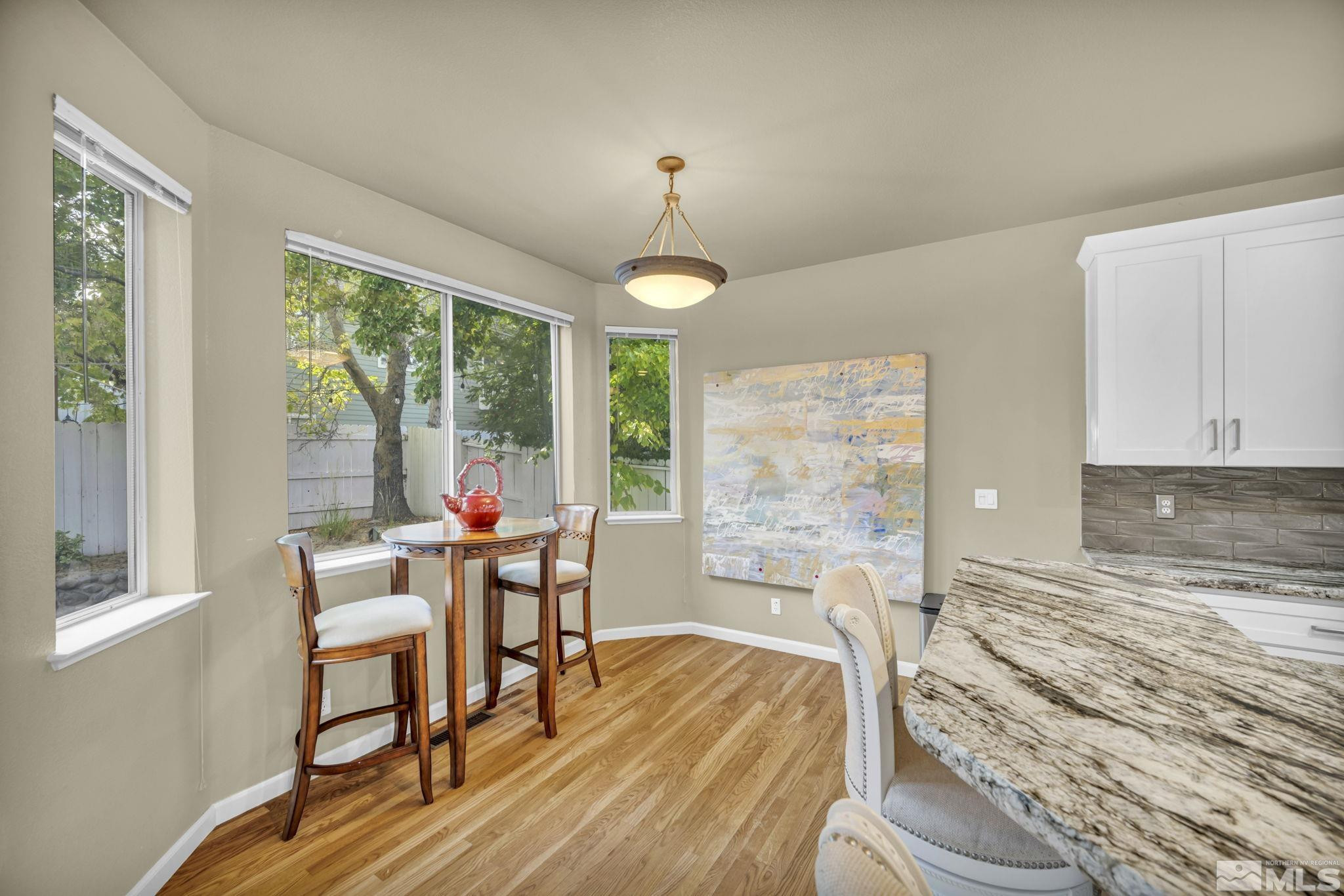 4731 Ellicott Way Reno, NV 89519 - Photo 6 of 36 a living room with furniture and a large window