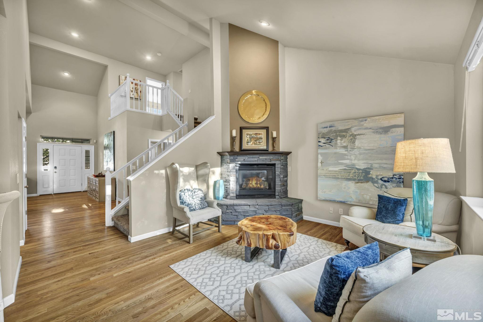4731 Ellicott Way Reno, NV 89519 - Photo 10 of 36 a living room with furniture and a wooden floor