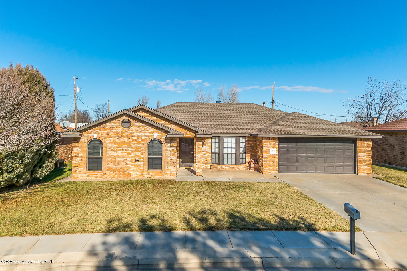 a front view of a house with yard
