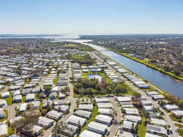 an aerial view of residential building and car parked