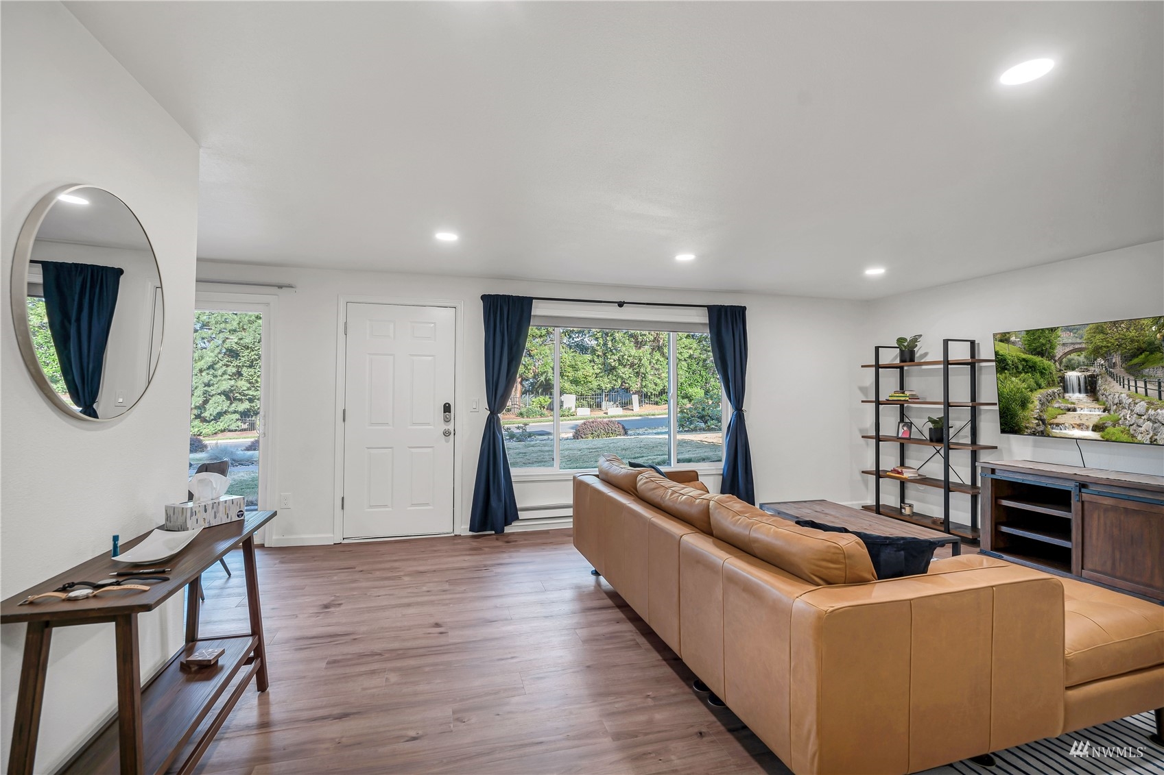 2102 Kelly Road, Unit 20 Vancouver, WA 98665 - Photo 8 of 25 a living room with furniture a large window and a wooden floor
