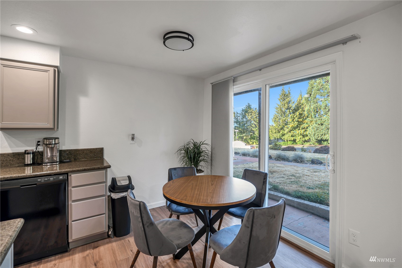 2102 Kelly Road, Unit 20 Vancouver, WA 98665 - Photo 10 of 25 a view of a dining room with furniture window and wooden floor