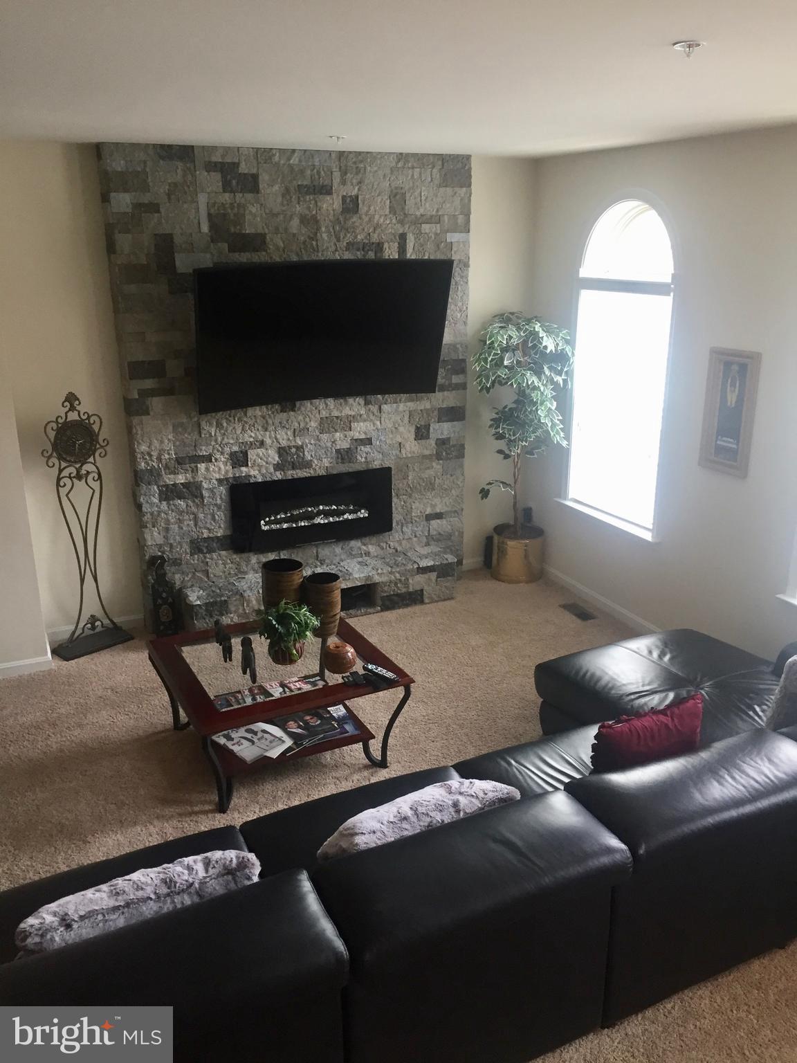 9702 Smithview Place Lanham, MD 20706 - Photo 8 of 15 Family Room (fireplace wall w/ electric fireplace)