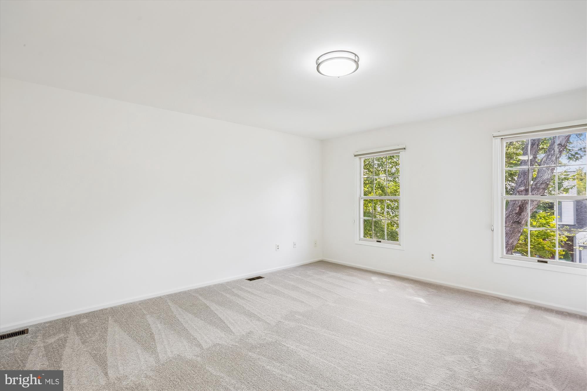 1944 Autumn Ridge Circle Silver Spring, MD 20906 - Photo 27 of 40 an empty room with windows