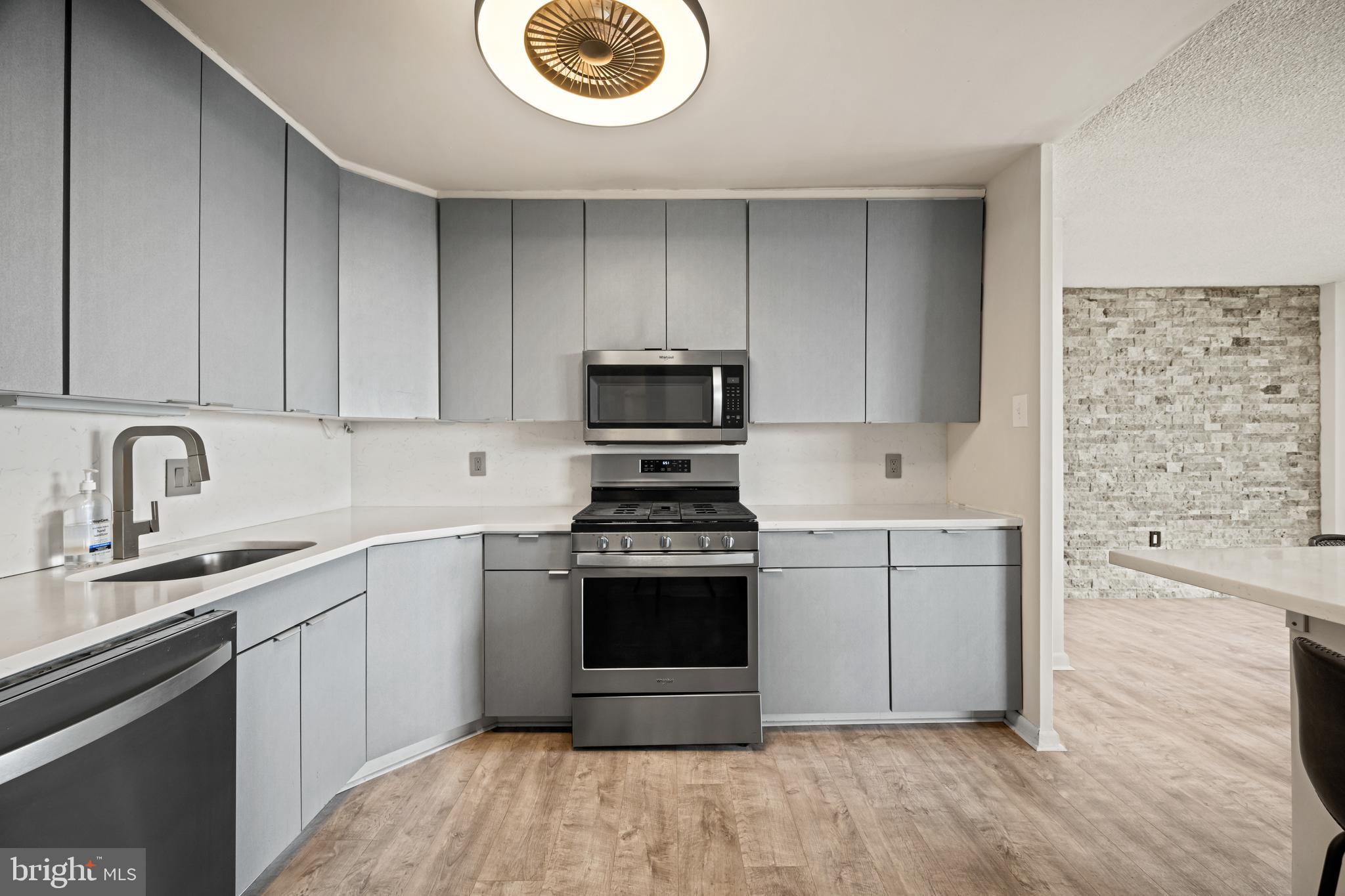 1840 Frontage Road, Unit 1501 Cherry Hill, NJ 08034 - Photo 4 of 20 a kitchen with a stove and a sink