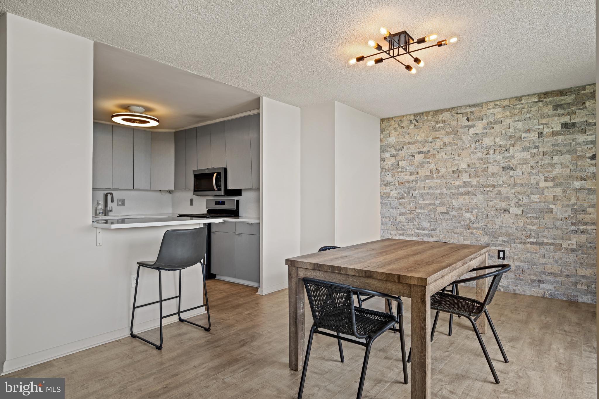 1840 Frontage Road, Unit 1501 Cherry Hill, NJ 08034 - Photo 8 of 20 a view of a dining room with furniture and wooden floor