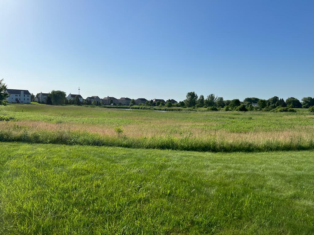 2148 Bartram Road North Aurora, IL 60542 - Photo 6 of 12 a view of a golf course with a lake
