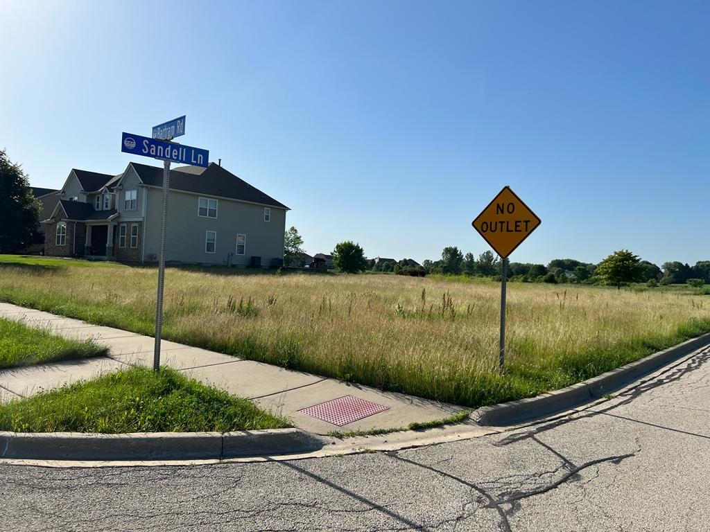 2148 Bartram Road North Aurora, IL 60542 - Photo 10 of 12 a lake view with a garden