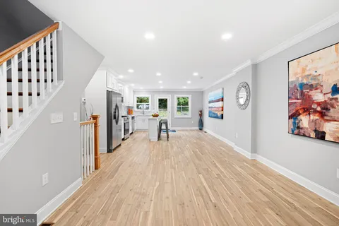 a view of a living room with wooden floor