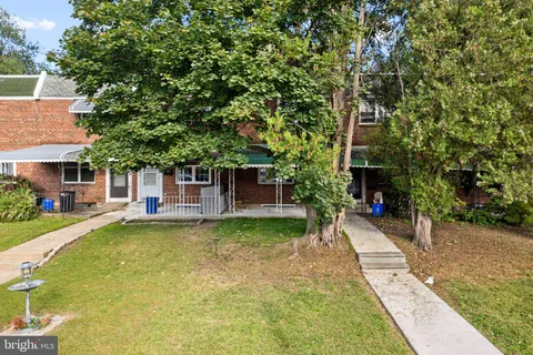 a view of a patio with table and chairs and potted plants
