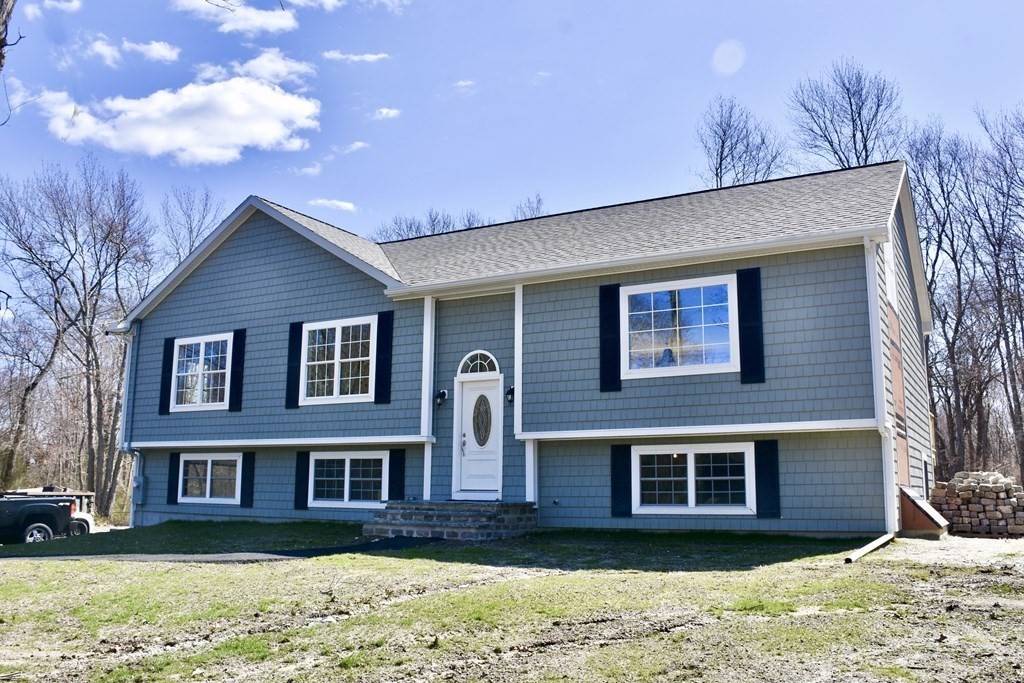 5 Woodlawn Road Freetown, MA 02702 - Photo 1 of 24 a front view of a house with a yard