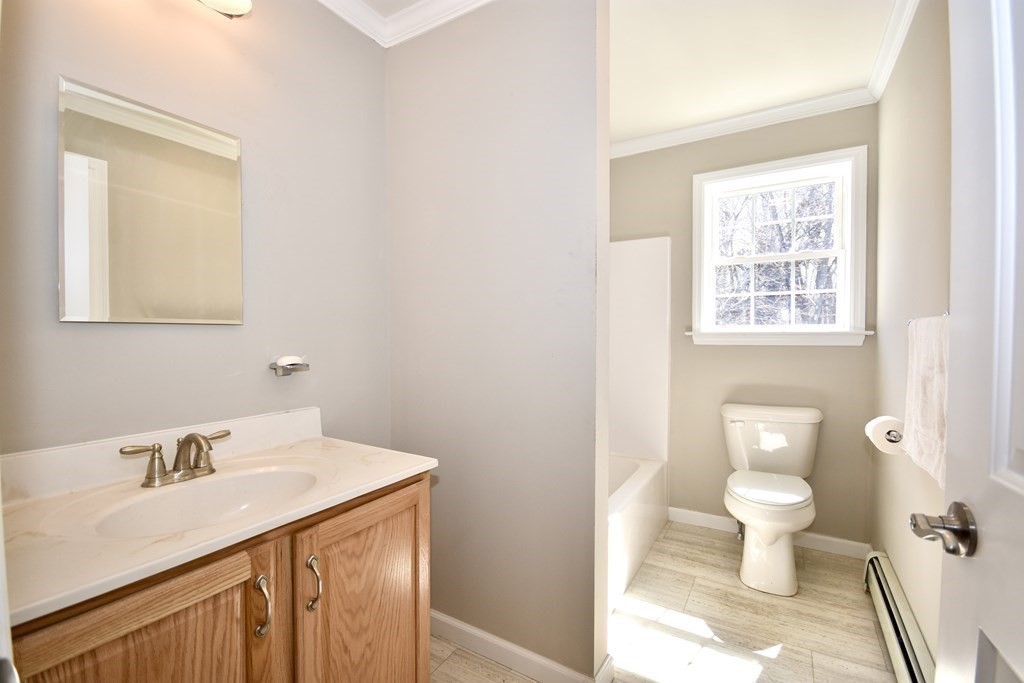 5 Woodlawn Road Freetown, MA 02702 - Photo 15 of 24 a bathroom with a sink toilet and a window