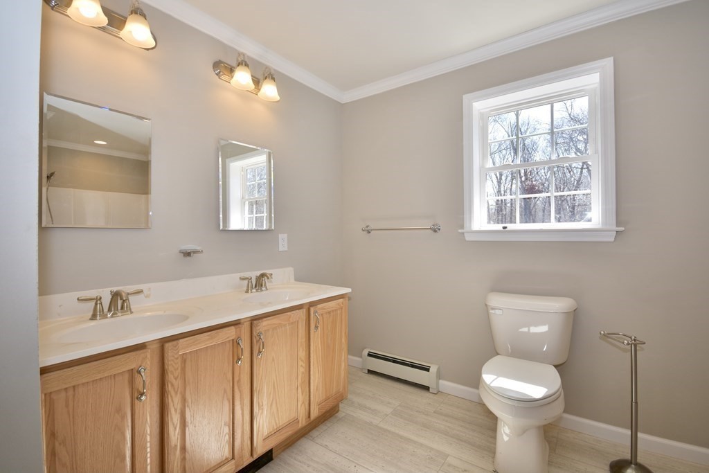 5 Woodlawn Road Freetown, MA 02702 - Photo 19 of 24 a bathroom with a toilet sink and mirror