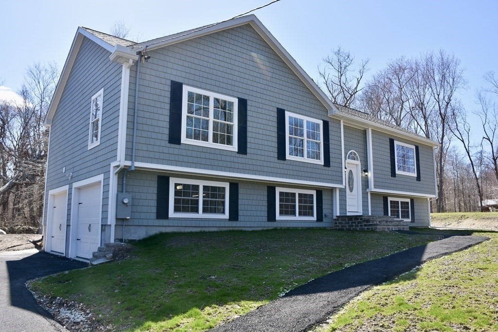 5 Woodlawn Road Freetown, MA 02702 - Photo 2 of 24 a view of a yard in front of a house
