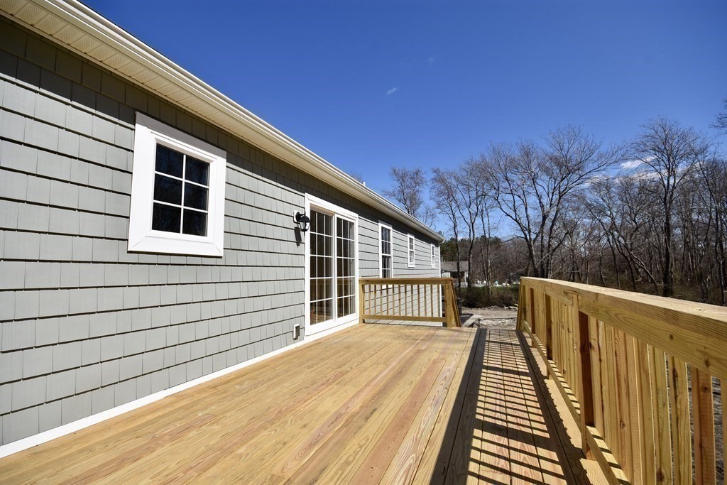 5 Woodlawn Road Freetown, MA 02702 - Photo 22 of 24 a view of balcony with wooden floor and fence and trees