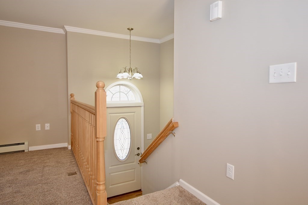 5 Woodlawn Road Freetown, MA 02702 - Photo 4 of 24 a view of a hallway with washer and dryer