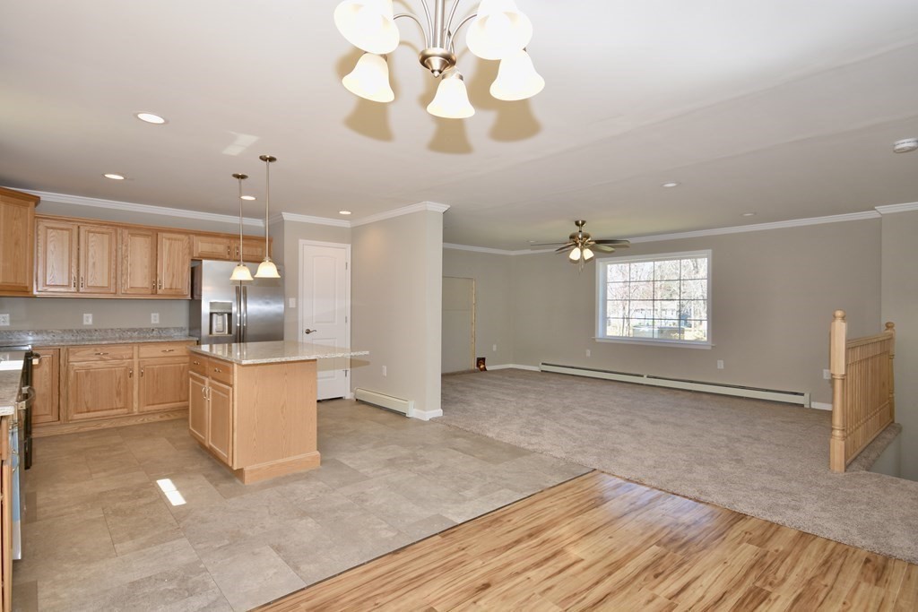 5 Woodlawn Road Freetown, MA 02702 - Photo 7 of 24 a view of kitchen with windows and refrigerator