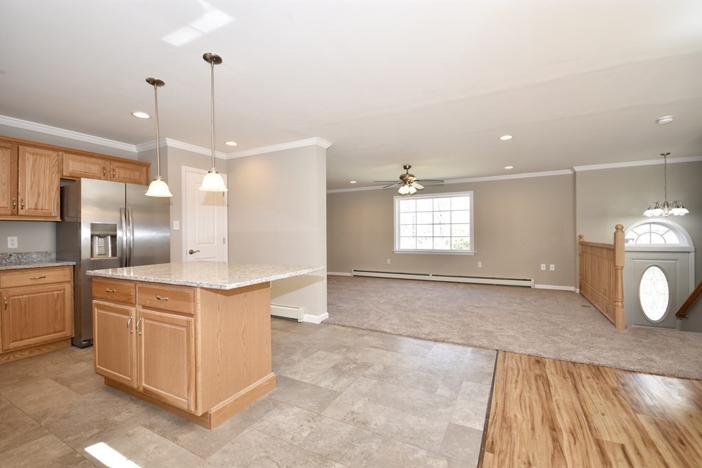 5 Woodlawn Road Freetown, MA 02702 - Photo 9 of 24 a kitchen with stainless steel appliances granite countertop a sink and a wooden floor
