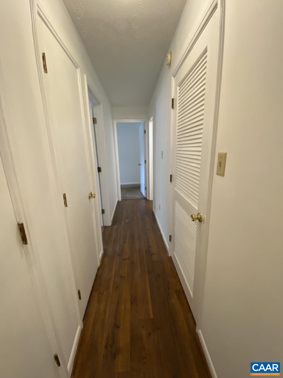 102 Turtle Creek Road, Unit 1 Charlottesville, VA 22901 - Photo 11 of 26 a view of a hallway with a door