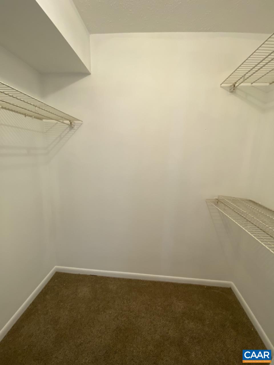 102 Turtle Creek Road, Unit 1 Charlottesville, VA 22901 - Photo 14 of 26 a view of a small space with racks on the wall