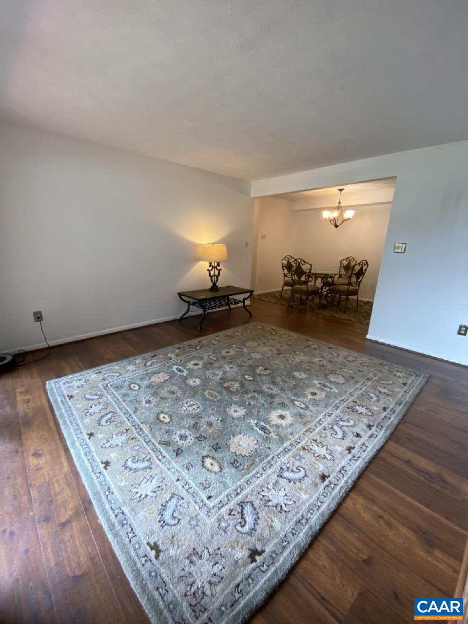 102 Turtle Creek Road, Unit 1 Charlottesville, VA 22901 - Photo 2 of 26 a view of a room with wooden floor