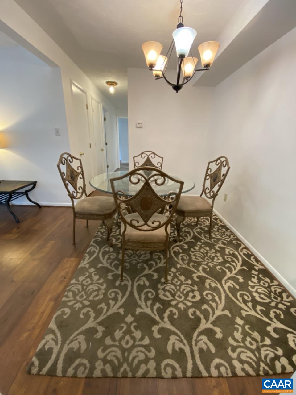 102 Turtle Creek Road, Unit 1 Charlottesville, VA 22901 - Photo 4 of 26 a view of a dining room with furniture
