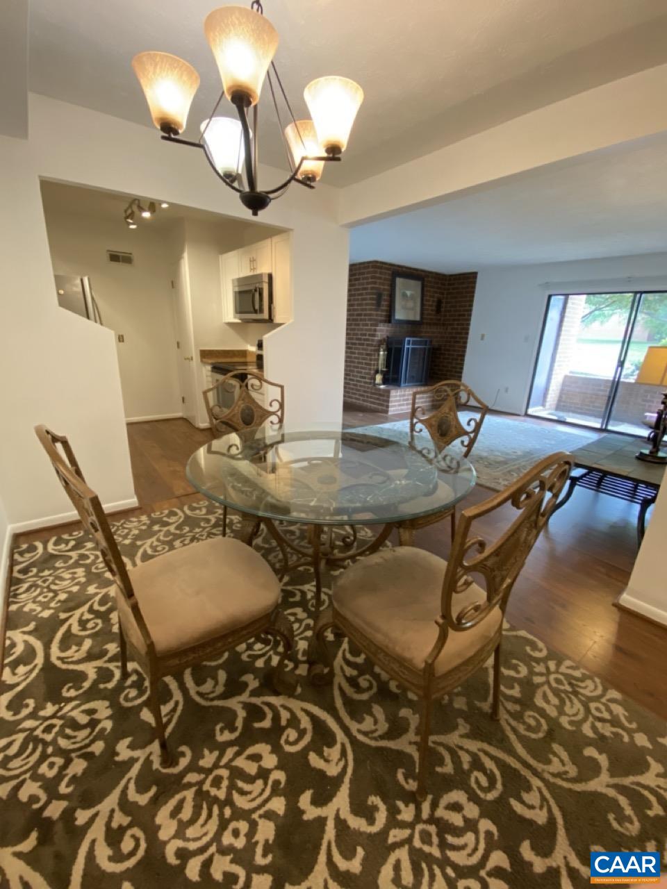 102 Turtle Creek Road, Unit 1 Charlottesville, VA 22901 - Photo 5 of 26 a view of a dining room with furniture