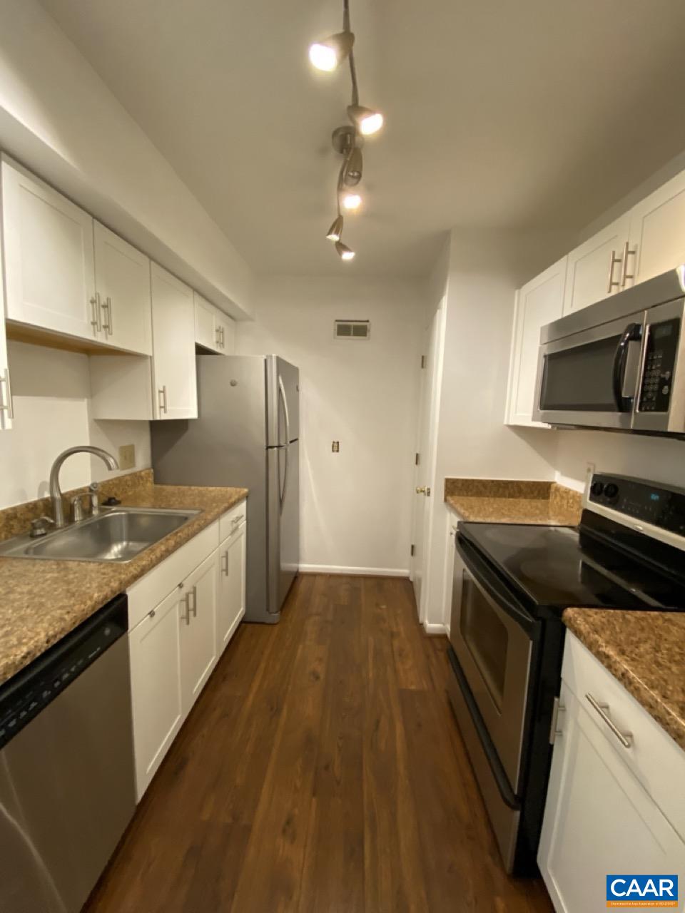 102 Turtle Creek Road, Unit 1 Charlottesville, VA 22901 - Photo 6 of 26 a kitchen with a sink stove and refrigerator
