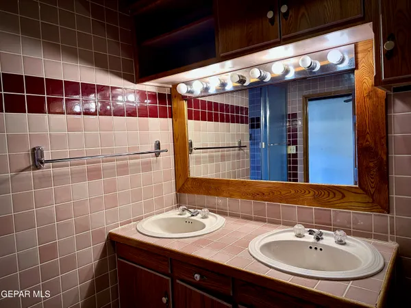 a bathroom with a bathtub and a window