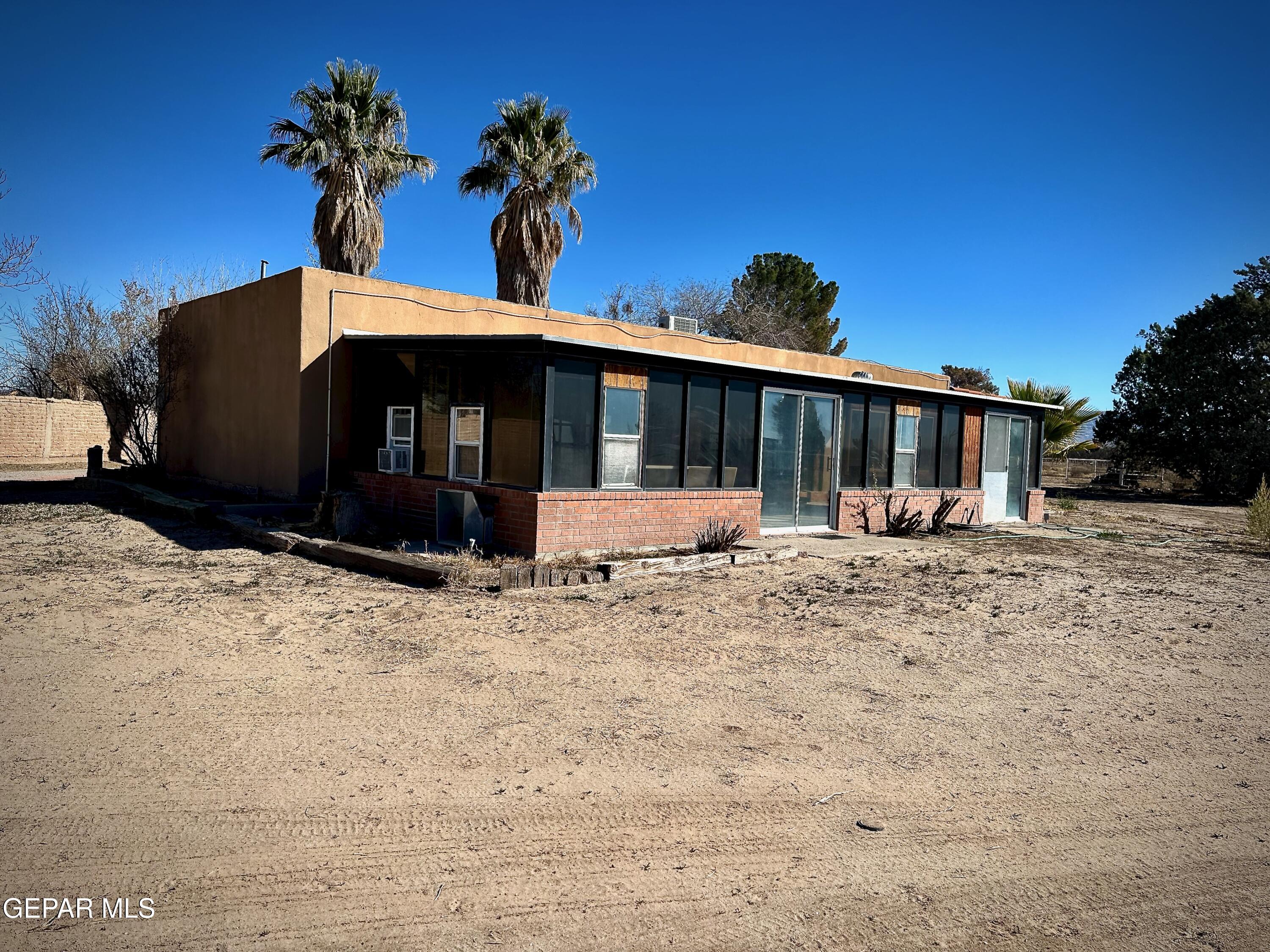 1095 Little Road Anthony, NM 88021 - Photo 25 of 30 a front view of a house with a yard