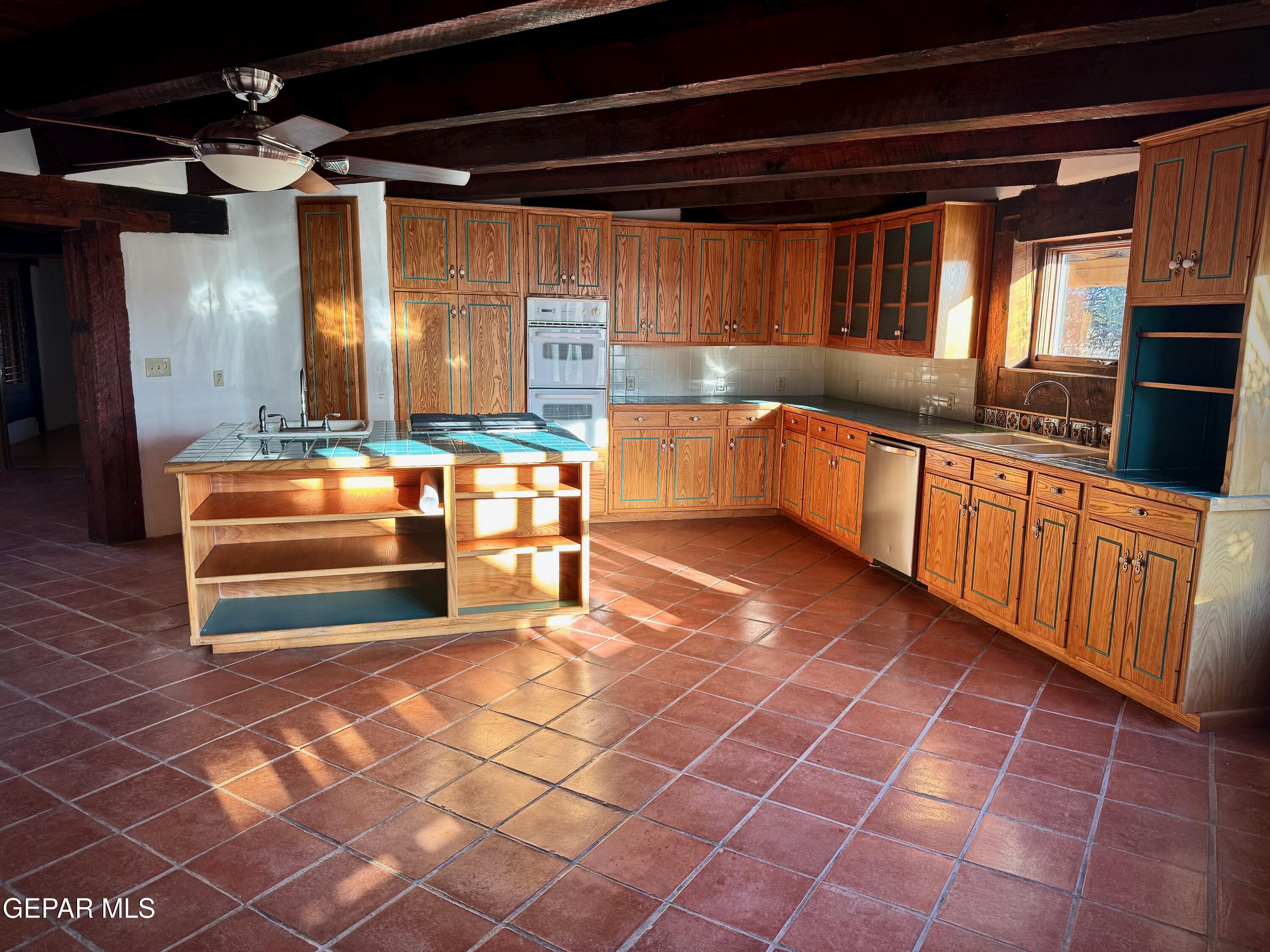 1095 Little Road Anthony, NM 88021 - Photo 6 of 30 a kitchen with stainless steel appliances a sink stove and cabinets