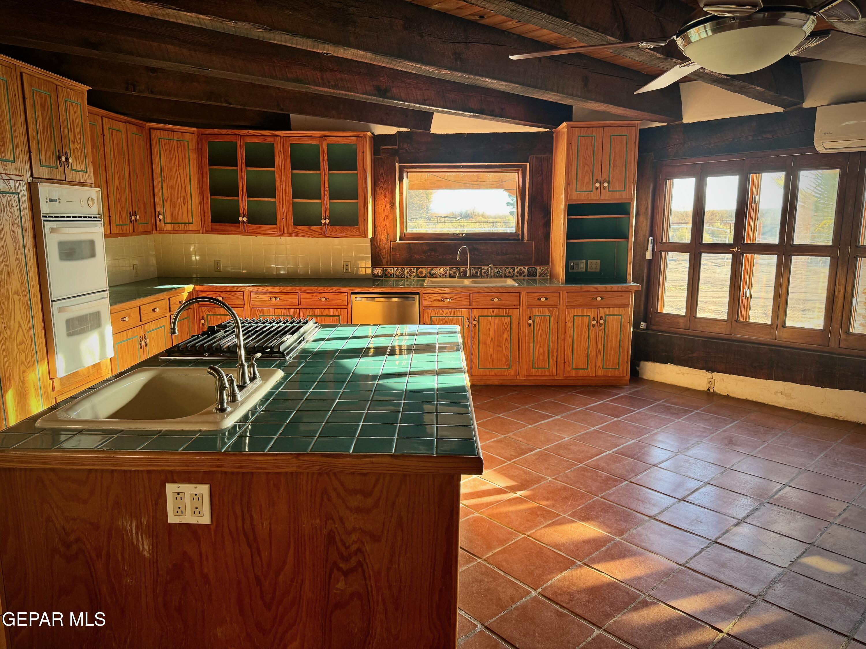 1095 Little Road Anthony, NM 88021 - Photo 7 of 30 a kitchen that has a sink and a stove