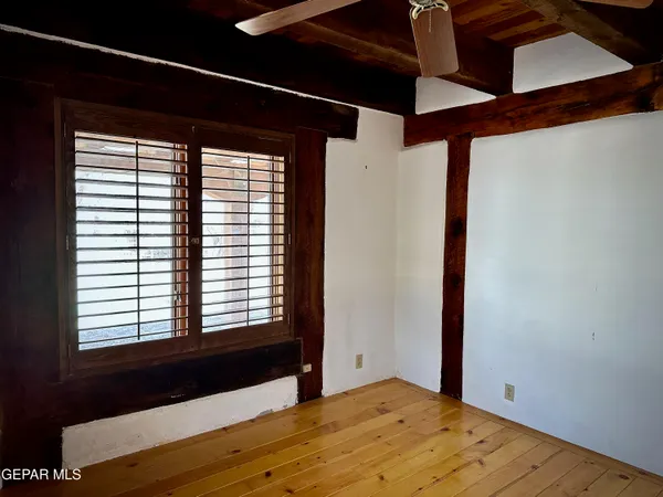 a bed room with a bed and a large window