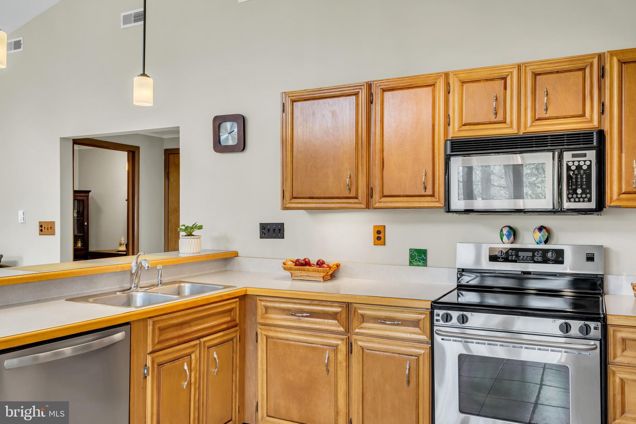 33 Poplar Street Sicklerville, NJ 08081 - Photo 26 of 62 a kitchen with stainless steel appliances granite countertop a sink stove and microwave