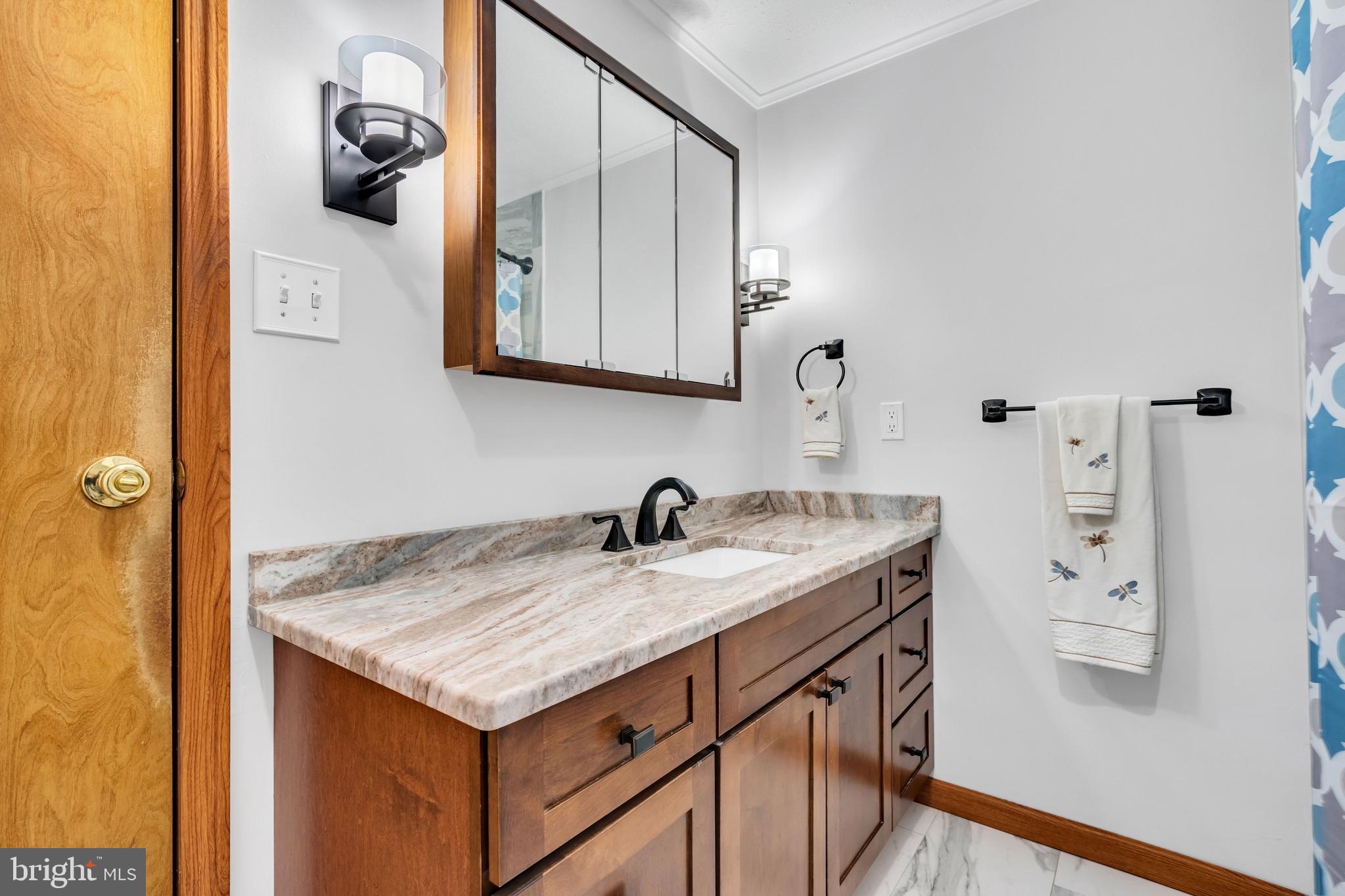 33 Poplar Street Sicklerville, NJ 08081 - Photo 35 of 62 a bathroom with a granite countertop sink and a mirror