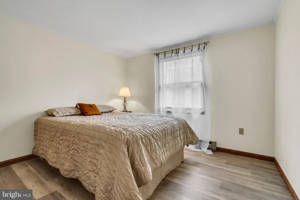 a bedroom with a bed and a television