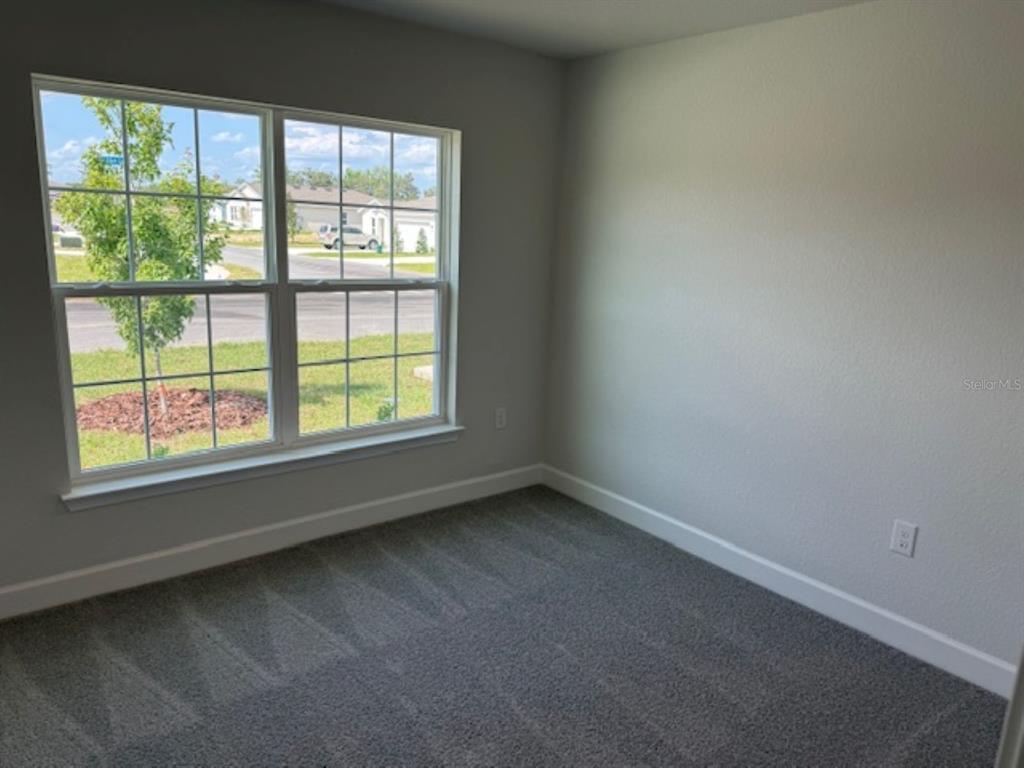 2150 Northwest 23rd Loop Ocala, FL 34475 - Photo 14 of 19 an empty room with a window