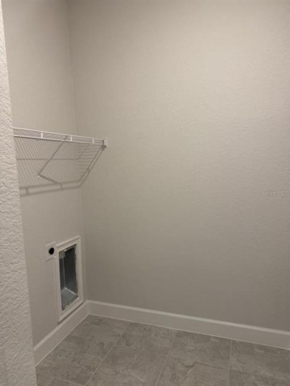 2150 Northwest 23rd Loop Ocala, FL 34475 - Photo 17 of 19 a view of a room with racks on the wall