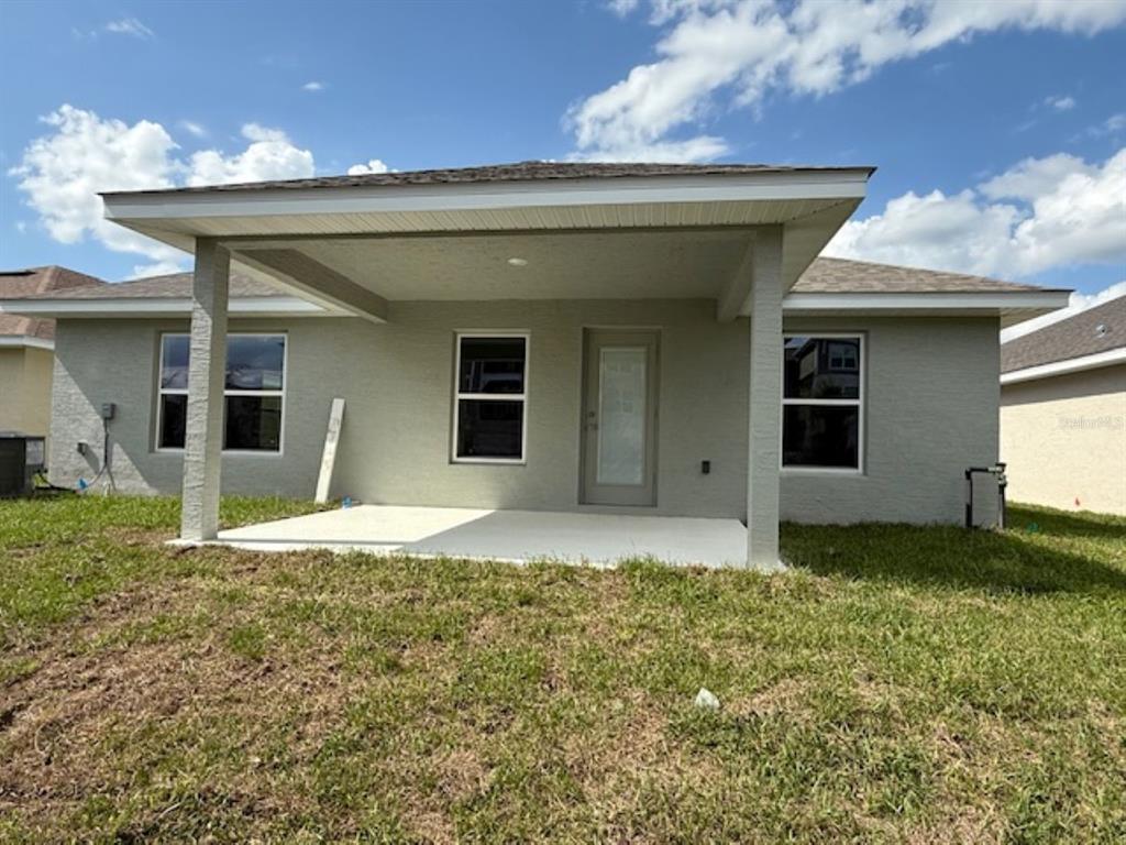 2150 Northwest 23rd Loop Ocala, FL 34475 - Photo 5 of 19 a house with yard in front of it