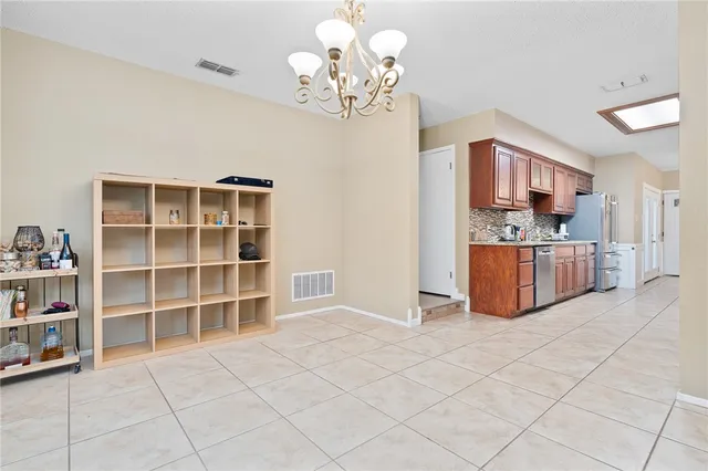 a view of kitchen with furniture and wooden floor